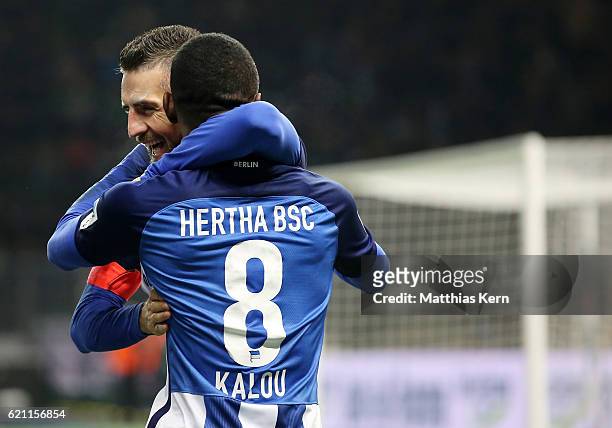 Salomon Kalou of Berlin jubilates with team mate Vedad Ibisevic after scoring the third goal during the Bundesliga match between Hertha BSC and...