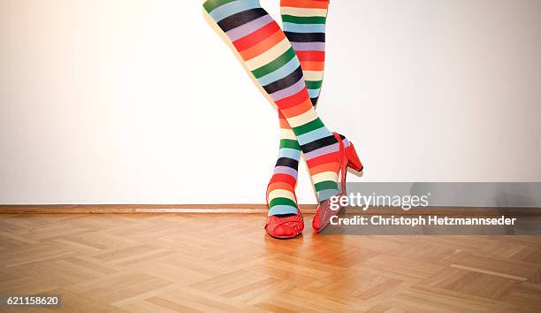 woman wearing funky socks - striped socks stock pictures, royalty-free photos & images