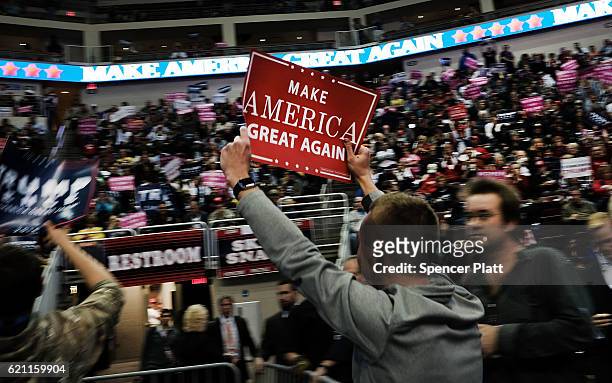 Supporters wait for Donald Trump to speak at a rally on November 4, 2016 in Hershey, Pennsylvania. Days before the presidential election, both...