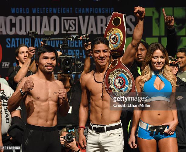 Manny Pacquiao and WBO welterweight champion Jessie Vargas pose during their official weigh-in at the Encore Theater at Wynn Las Vegas on November 4,...
