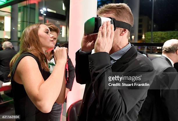 Guest tries out Virtual Reality eyeglasses after the ceremonial act of the DFB Bundestag at Theater Erfurt on November 3, 2016 in Erfurt, Germany.