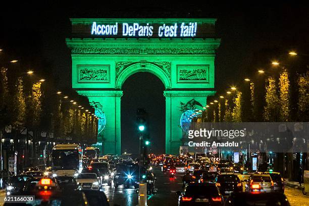 The Arc de Triomphe is illuminated in green to celebrate the ratification of the COP21 climate change agreement in Paris, France on November 04, 2016.