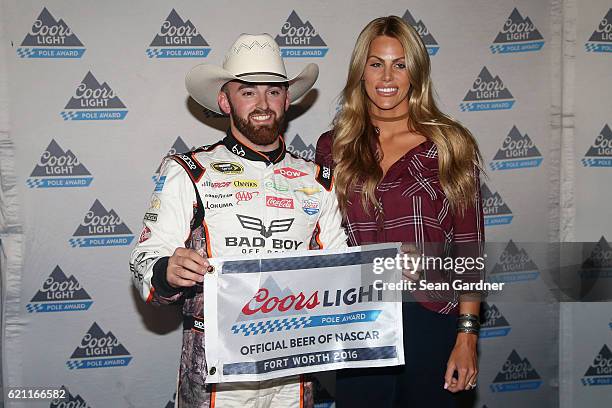 Austin Dillon, driver of the Realtree/Bad Boy Chevrolet, poses with the Coors Light Pole Award and his girlfriend, Whitney Ward, after qualifying for...