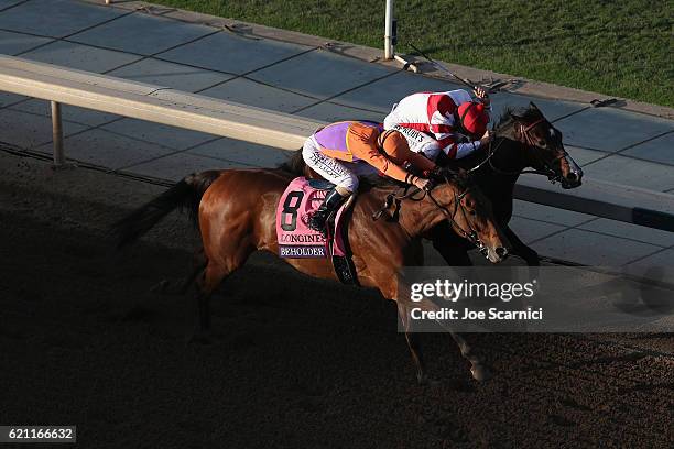 Beholder ridden by jockey Gary Stevens wins in the Longines Breeders' Cup Distaff during day one of the 2016 Breeders' Cup World Championships at...