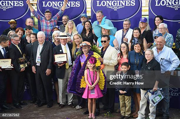 Jockey Gary Stevens celebrates in the winner's circle after winning the Longines Breeders' Cup Distaff during day one of the 2016 Breeders' Cup World...