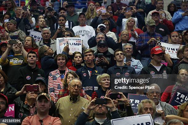 Donald Trump supporters wait for him to speak at a rally on November 4, 2016 in Hershey, Pennsylvania. Days before the presidential election, both...