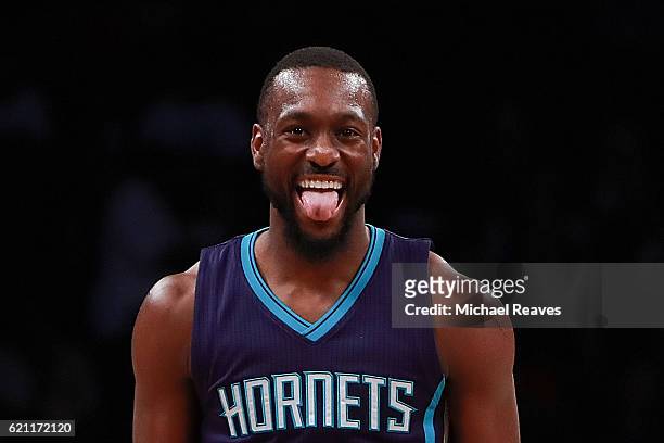 Kemba Walker of the Charlotte Hornets reacts after hitting a shot against the Brooklyn Nets during the second half at Barclays Center on November 4,...