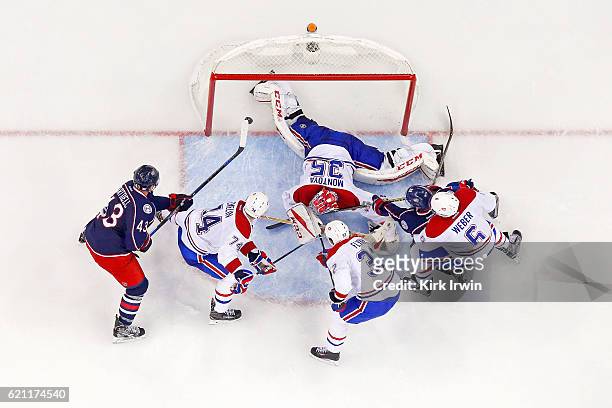 Scott Hartnell of the Columbus Blue Jackets flips the puck past Al Montoya of the Montreal Canadiens for a goal during the second period on November...