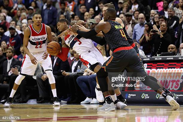 Paul Millsap of the Atlanta Hawks and Bradley Beal of the Washington Wizards go after the ball in the fourth quarter of the Wizards 95-92 win at...