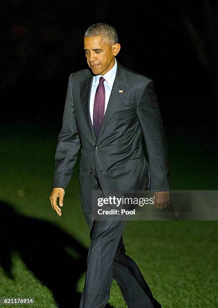 President Barack Obama walks across the South Lawn as he arrives at the White House November 4, 2016 in Washington, DC. Obama is making campaign...