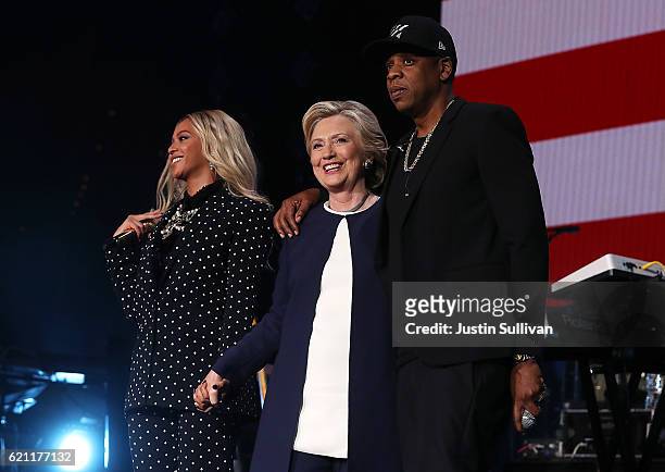 Beyonce, Democratic presidential nominee former Secretary of State Hillary Clinton and Jay Z appear on stage during a Get Out The Vote concert at...