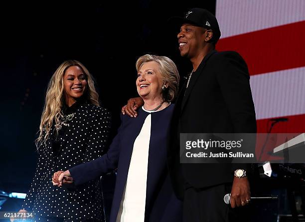 Recording artist Jay Z is seen on a screen as he performs during a Get Out The Vote concert Democratic presidential nominee former Secretary of State...
