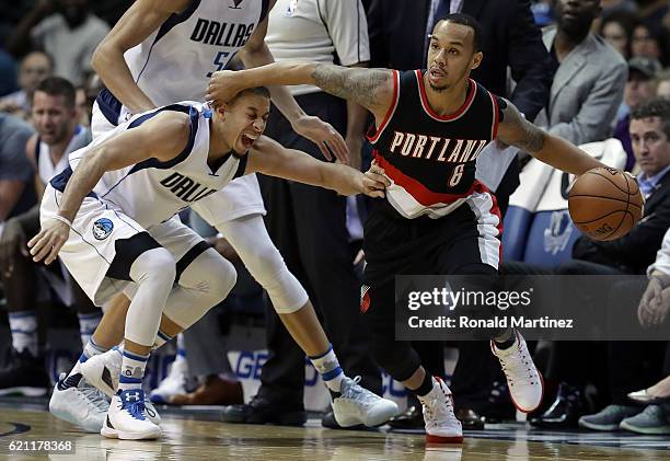 Shabazz Napier of the Portland Trail Blazers dribbles the ball against Seth Curry of the Dallas Mavericks in the second half at American Airlines...