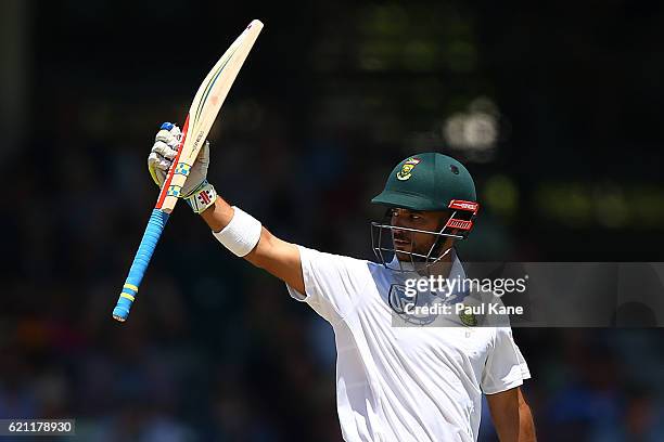 Jean-Paul Duminy of South Africa raises his bat to the players rooms after reaching his half century during day three of the First Test match between...