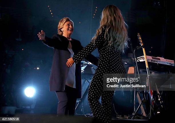 Democratic presidential nominee former Secretary of State Hillary Clinton greets recording artist Beyonce during a Get Out The Vote concert at...