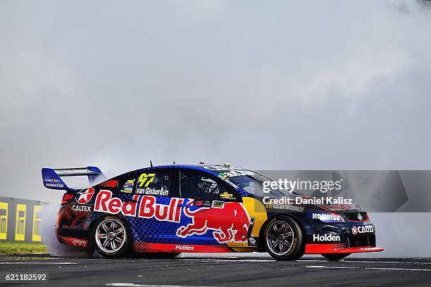 Shane Van Gisbergen drives the Red Bull Racing Australia Holden Commodore VF celebrates with a victory burnout after winning race 2 for the Supercars...