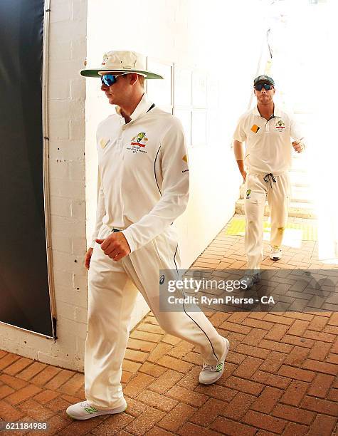 Steve Smith and David Warner of Australia lead their team out during day three of the First Test match between Australia and South Africa at WACA on...