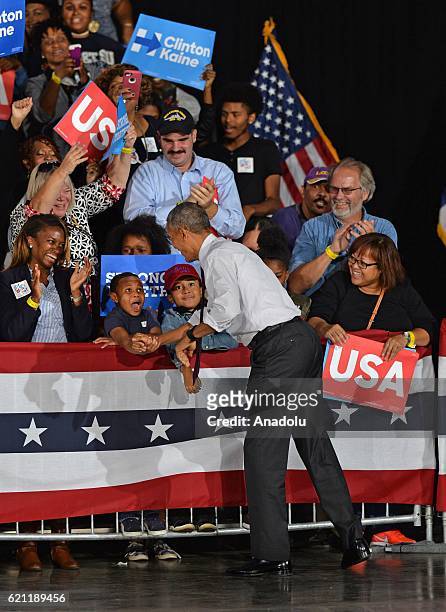 President Barack Obama salutes the people during a presidential election campaign rally, supporting Democrat Party's Presidential Candidate Hillary...