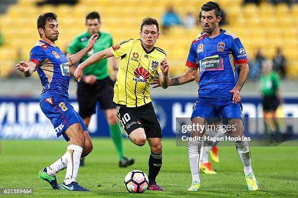 Michael McGlinchey of the Phoenix attempts to beat the Jets defence during the round five A-League match between the Wellington Phoenix and the...