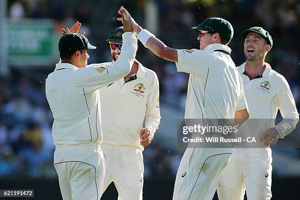 Usman Khawaja of Australia celebrates after taking a catch to dismiss Temba Bavuma of South Africa off the bowling of Mitch Marsh of Australia during...