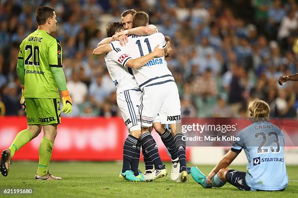 Marco Rojas and Besart Berisha of the Victory clelebrate with Mitch Austin of the Victory after he scored a goal during the round five A-League match...