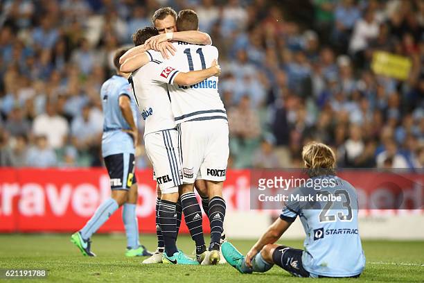 Marco Rojas and Besart Berisha of the Victory clelebrate with Mitch Austin of the Victory after he scored a goal during the round five A-League match...