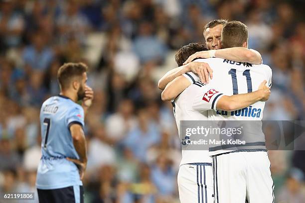 Marco Rojas and Besart Berisha of the Victory clelebrate with Mitch Austin of the Victory after he scored a goal during the round five A-League match...