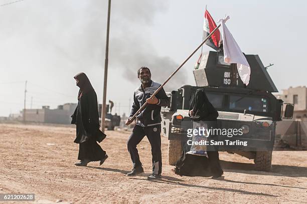 Civilians flee from the Zahara neighbourhood on the north eastern edge of Mosul the morning after it was taken back from ISIS by Iraqi Special...