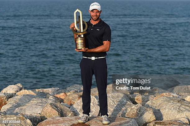 Bernd Ritthammer of Germany poses with the trophy after winning the NBO Golf Classic Grand Final at Al Mouj Golf on November 5, 2016 in Muscat, Oman.