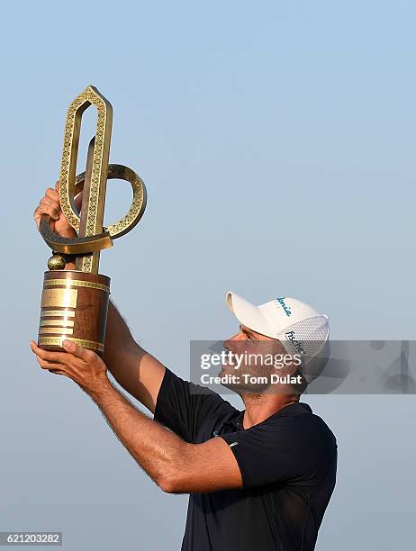 Bernd Ritthammer of Germany poses with the trophy after winning the NBO Golf Classic Grand Final at Al Mouj Golf on November 5, 2016 in Muscat, Oman.