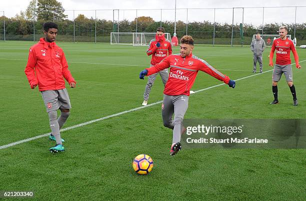 Gedion Zelalem and Alex Oxlade-Chamberlain of Arsenal during a training session at London Colney on November 5, 2016 in St Albans, England.