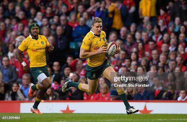 Reece Hodge of Australia runs in his team's second try during the international match between Wales and Australia at the Principality Stadium on...