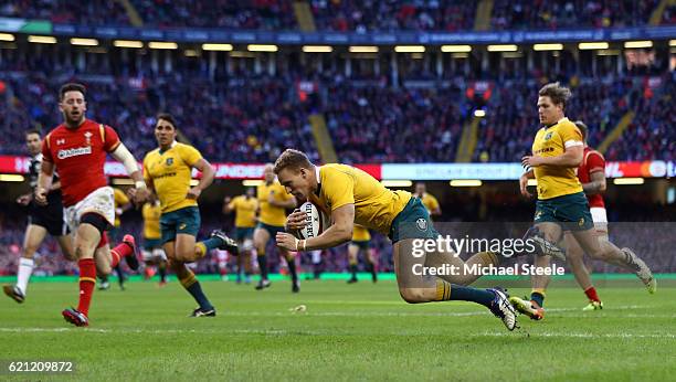 Reece Hodge of Australia dives over to score his team's second try during the international match between Wales and Australia at the Principality...