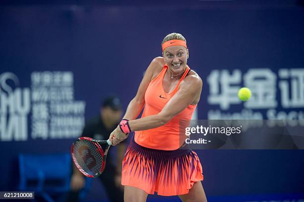 Petra Kvitova of the Czech Republic hits a return against Zhang Shuai of China during their women's singles semi-final match at the WTA Elite Trophy...