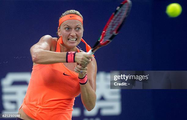 Petra Kvitova of the Czech Republic hits a return against Zhang Shuai of China during their women's singles semi-final match at the WTA Elite Trophy...