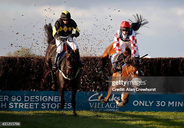 Tom O'Brien riding Gentleman Jon clear the last to win The Badger Ales Trophy Handicap Steeple Chase as Harry Cobden riding Southfield Theatre fall...