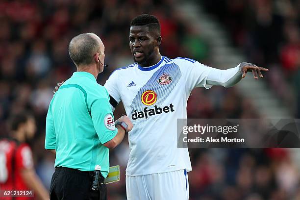 Referee Mike Dean speaks to Papy Djilobodji of Sunderland during the Premier League match between AFC Bournemouth and Sunderland at Vitality Stadium...