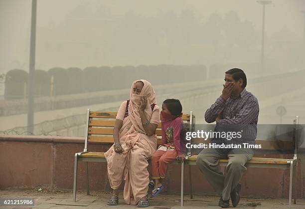 People cover their face with mask to avoid thick smog this evening, as the whole city is engulfed in heavy smog; air quality deteriorated sharply...