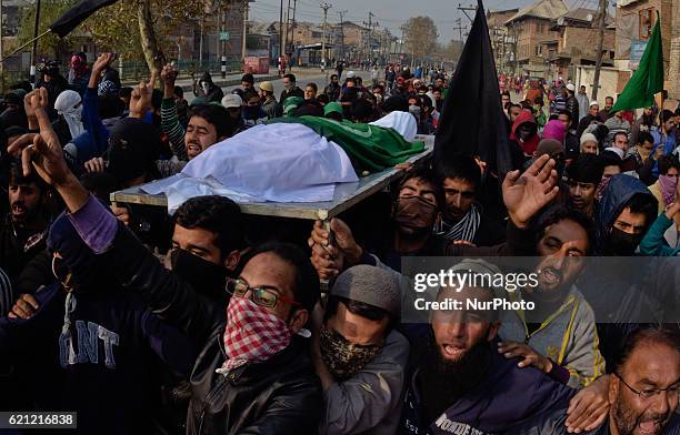 Kashmiri Muslims carry the body of Qaisar Sofi, a 16 year old boy who succumbed to his injuries, during his funeral on November 05, 2016 in Srinagar...