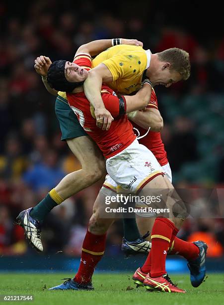 Reece Hodge of Australia is tackled by Sam Davies of Wales during the international match between Wales and Australia at the Principality Stadium on...