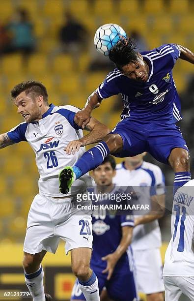 Iraq's Air Force Club forward Emad Mohsin Majeed and India's Bengaluru club midfielder Cameron Watson vie for the ball during the AFC Asian Cup final...