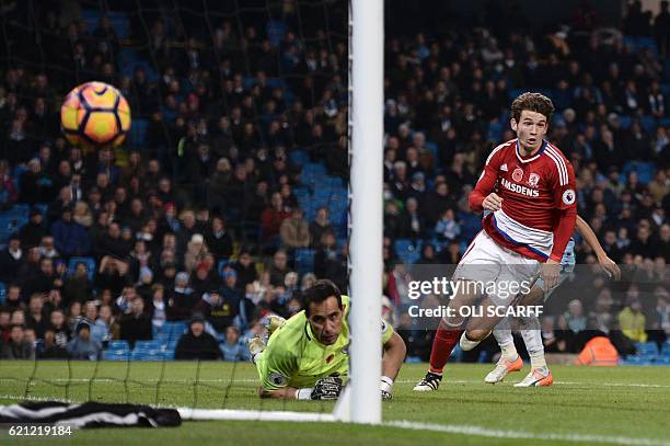 Middlesbrough's Dutch midfielder Marten de Roon wheels away to celebrate after scoring a late equalising goal for 1-1 as Manchester City's Chilean...