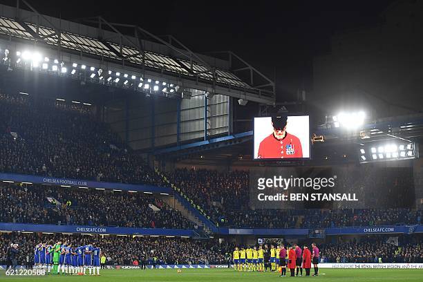 Chelsea Pensioner is shown on the screen as players observe a minute of silence in honour of Remembrance Day ahead of the English Premier League...