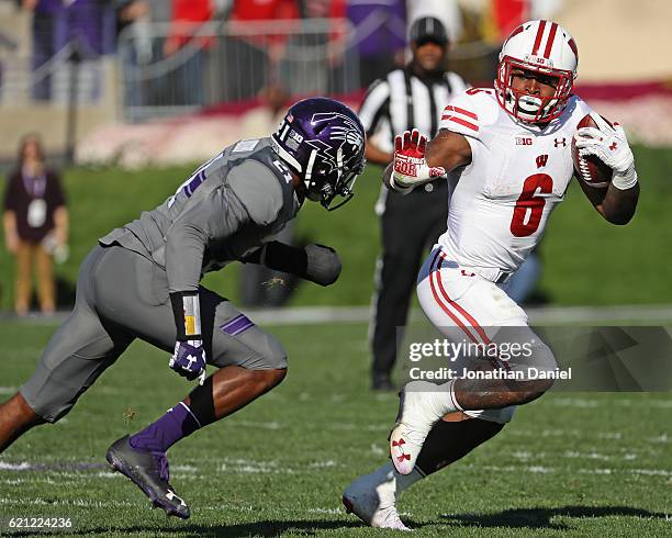 Corey Clement of the Wisconsin Badgers is pursued by Kyle Queiro of the Northwestern Wildcats at Ryan Field on November 5, 2016 in Evanston, Illinois.