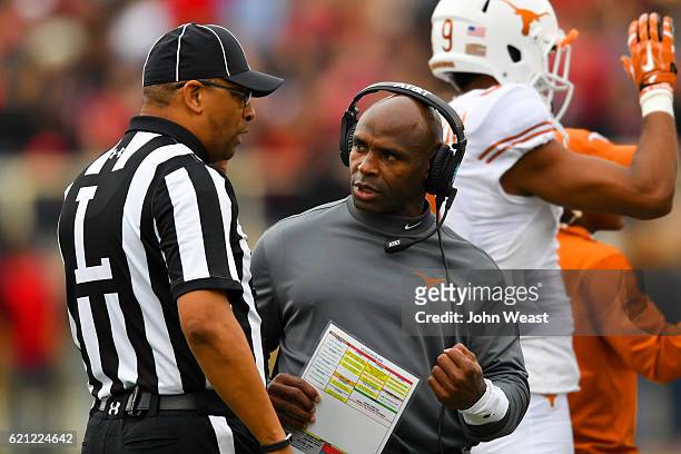 Head coach Charlie Strong of the Texas Longhorns discuss a call with an official during the first half of the game between the Texas Tech Red Raiders...