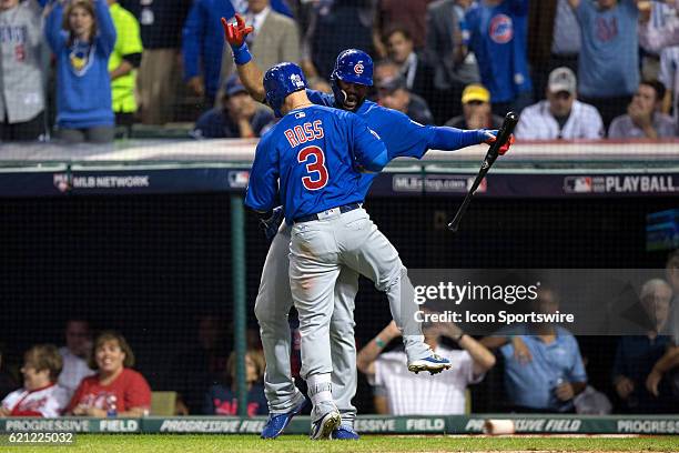 Chicago Cubs Catcher David Ross and Chicago Cubs Outfielder Jason Heyward celebrate after Ross hit a home run to center field during the sixth inning...