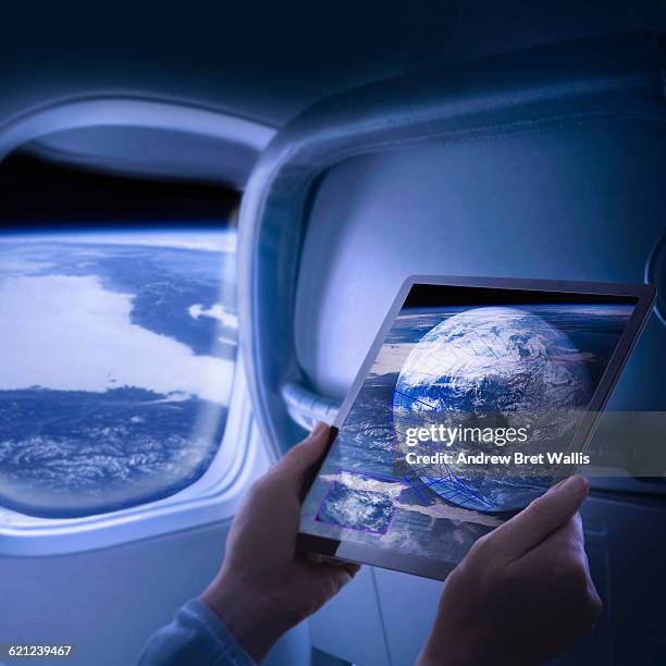 woman views screen data on passenger space flight - space tourism stock pictures, royalty-free photos & images