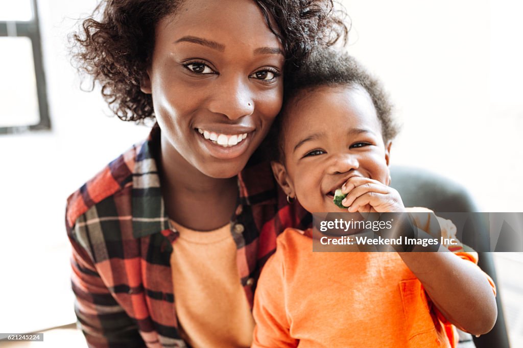 Adorable baby eating snack