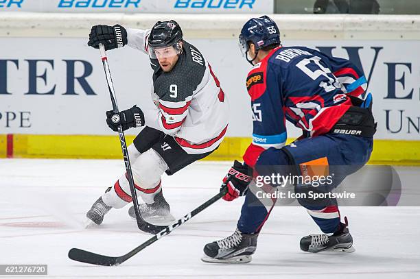 Derek Roy tries to pass Dalibor Bortnak during the Deutschland Cup between Slovakia and Canada on 5 November, 2016 at Curt Frenzel Stadium in...