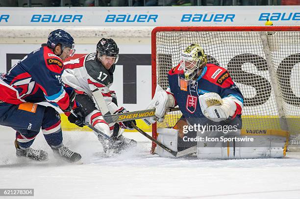 Kevin Clark tries to score against Goalie Jaroslav Janus during the Deutschland Cup between Slovakia and Canada on 5 November, 2016 at Curt Frenzel...